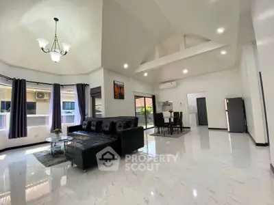 Spacious modern living room with high ceilings and elegant decor