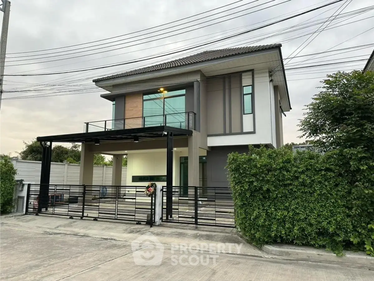 Modern two-story house with sleek design and spacious driveway