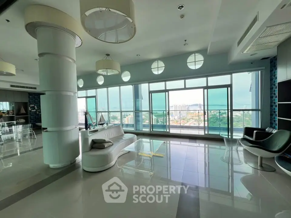Luxurious modern living room with panoramic city views and elegant furnishings