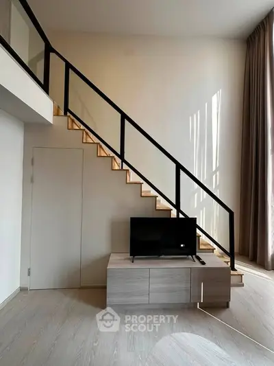 Modern loft apartment with sleek staircase and stylish interior design