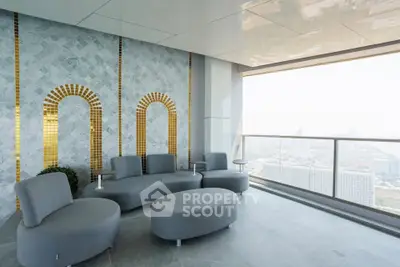 Luxurious high-rise balcony with stunning city view and modern seating area.