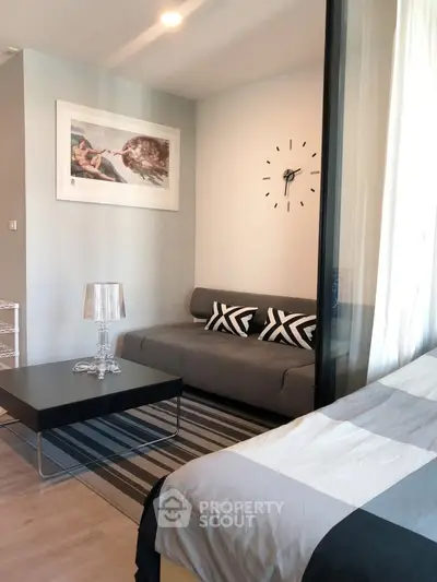 Modern living room with stylish decor and comfortable seating in a cozy apartment.