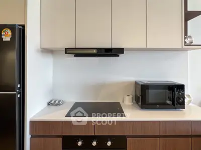 Modern kitchen with sleek appliances and minimalist design
