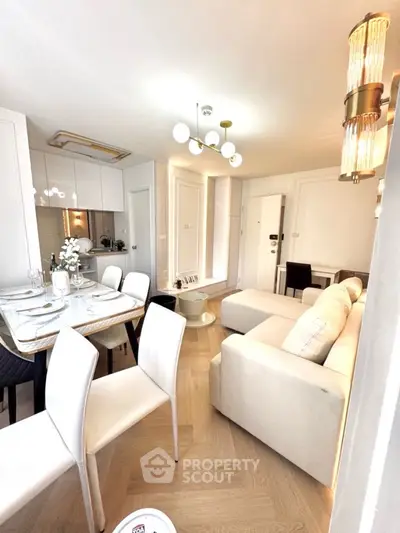 Modern living room with elegant dining area and stylish lighting