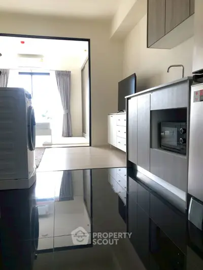 Modern apartment kitchen with sleek appliances and open layout