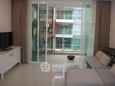 Modern living room with balcony view in urban apartment