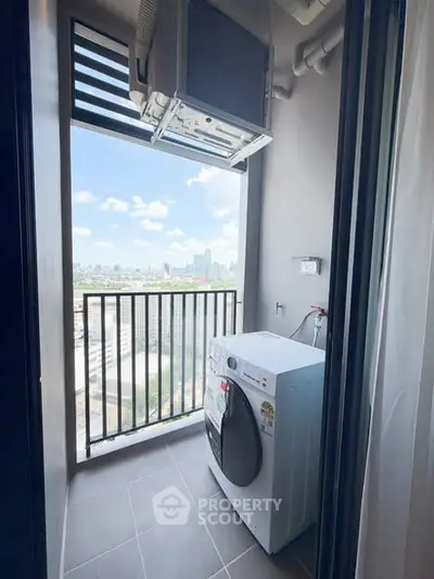 High-rise apartment balcony with city view and washing machine setup.