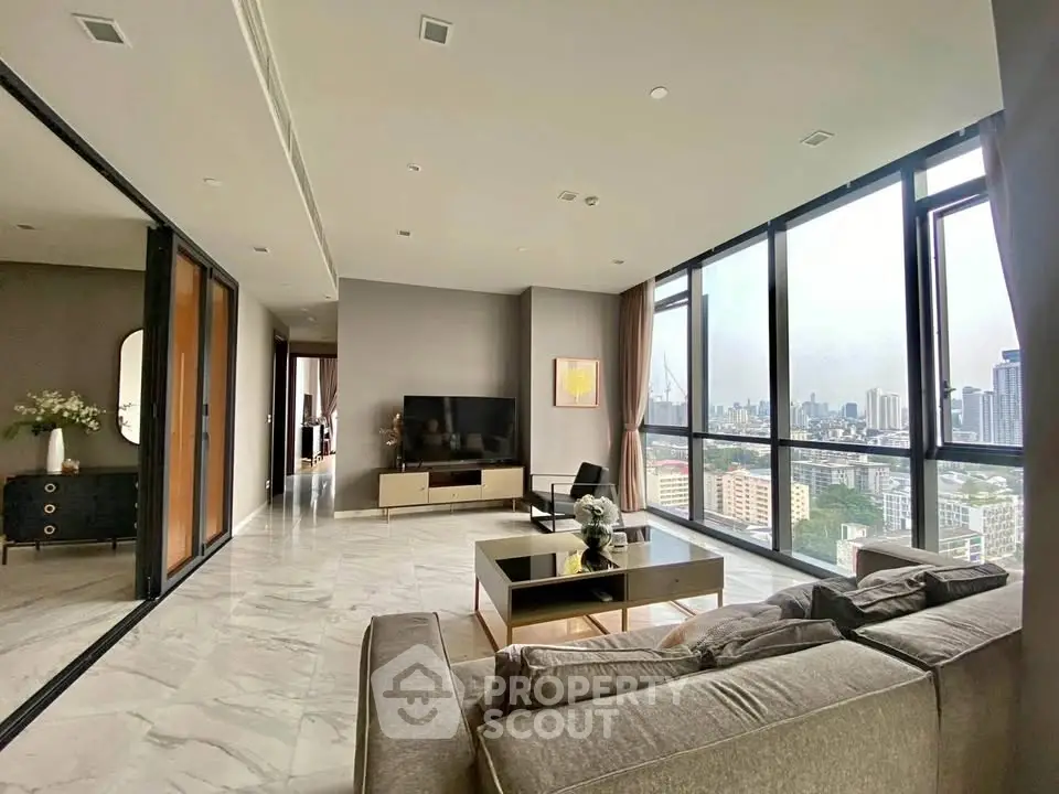 Spacious modern living room with panoramic city views and elegant decor