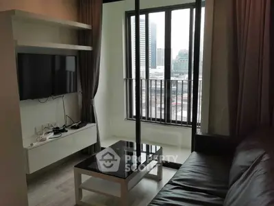 Modern living room with city view, featuring sleek furniture and large windows for natural light.