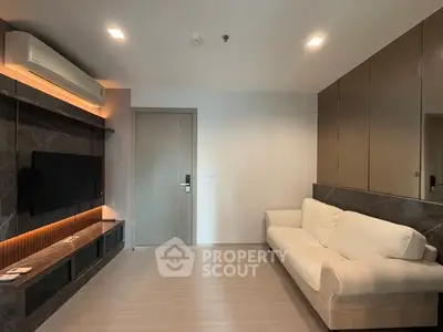 Modern living room with sleek design and cozy white sofa