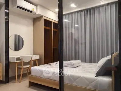 Modern bedroom with stylish furniture and air conditioning in a cozy apartment.