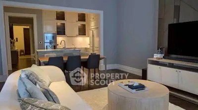 Modern living room with open kitchen layout and stylish decor