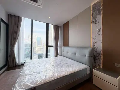 Luxurious bedroom with stunning city view and modern decor