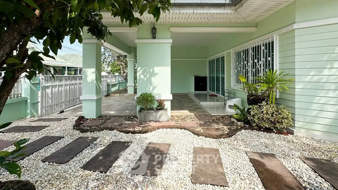 Charming garden entrance with lush greenery and modern design