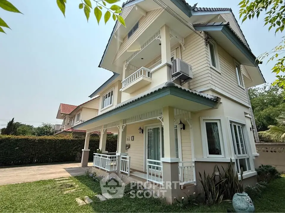 Charming two-story house with lush garden and spacious driveway in serene neighborhood.