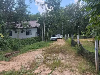 Charming rural property with lush greenery and private driveway, perfect for nature lovers seeking tranquility.