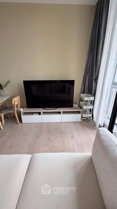 Modern living room with sleek TV setup and elegant decor