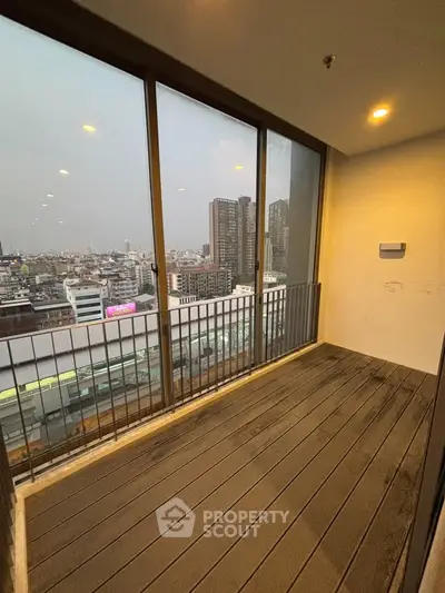 Spacious balcony with stunning city view in modern high-rise apartment