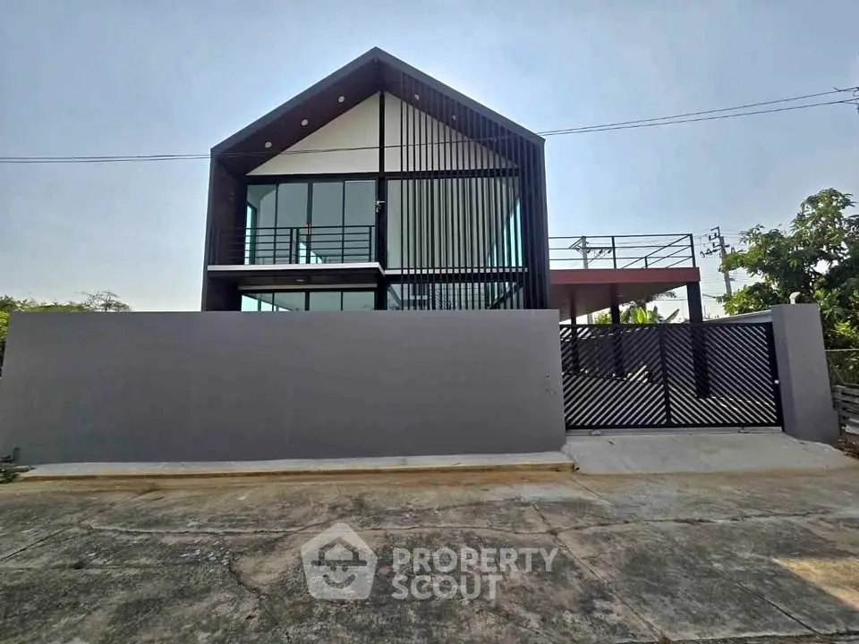 Modern architectural home with sleek design and spacious balcony, perfect for contemporary living.