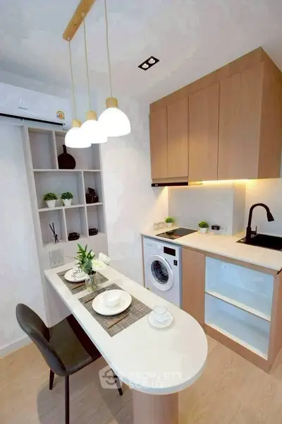 Modern kitchen with sleek design, featuring built-in appliances and stylish lighting.