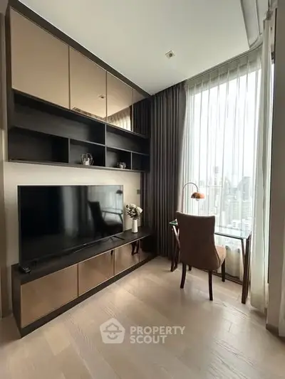 Modern living room with sleek TV unit and city view from large window