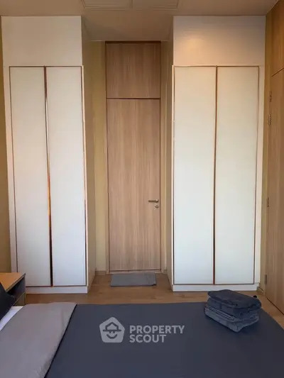 Modern bedroom with sleek wardrobes and minimalist design