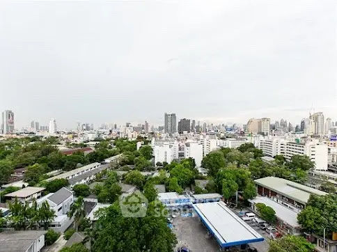 Stunning cityscape view showcasing urban skyline and lush greenery, perfect for real estate investment.
