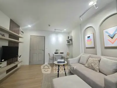 Modern living room with cozy sofa and stylish decor in a contemporary apartment.