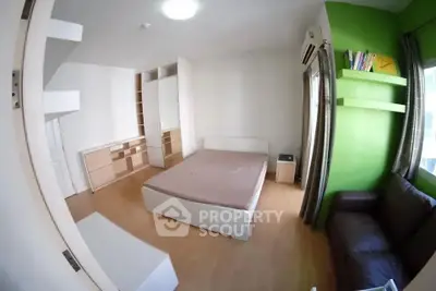 Spacious bedroom with modern design and vibrant green accent wall