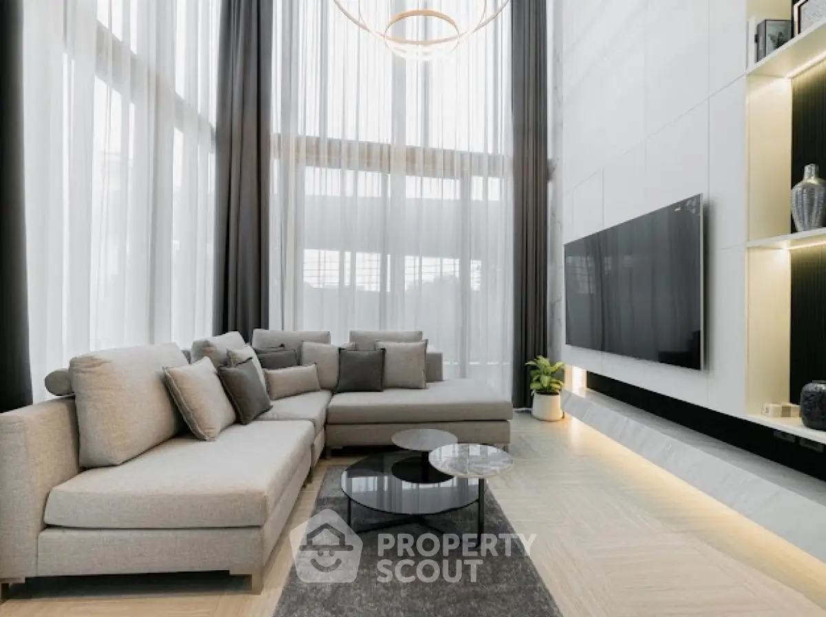 Luxurious modern living room with high ceilings and elegant decor