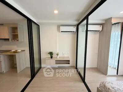 Modern living room with glass partitions and dual air conditioning units