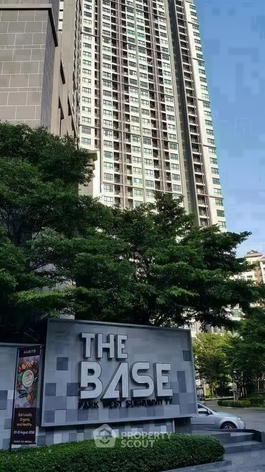 Modern high-rise building with lush greenery at The Base Park West Sukhumvit.