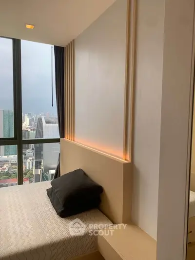 Modern bedroom with stunning city view and sleek design elements