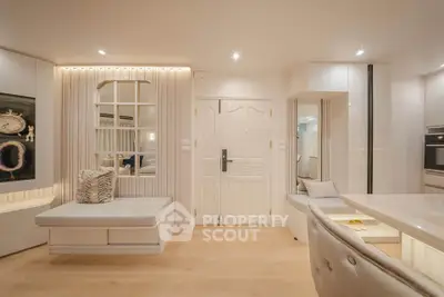 Luxurious modern living room with elegant decor and open layout, featuring stylish furniture and ambient lighting.