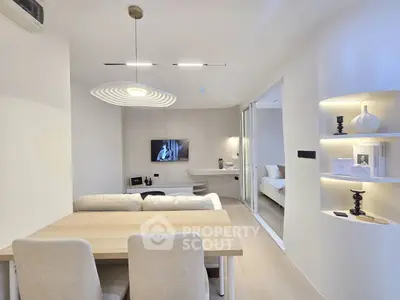 Modern living room with sleek design and cozy dining area