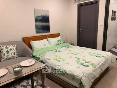 Cozy bedroom with modern decor and dining area, perfect for urban living.