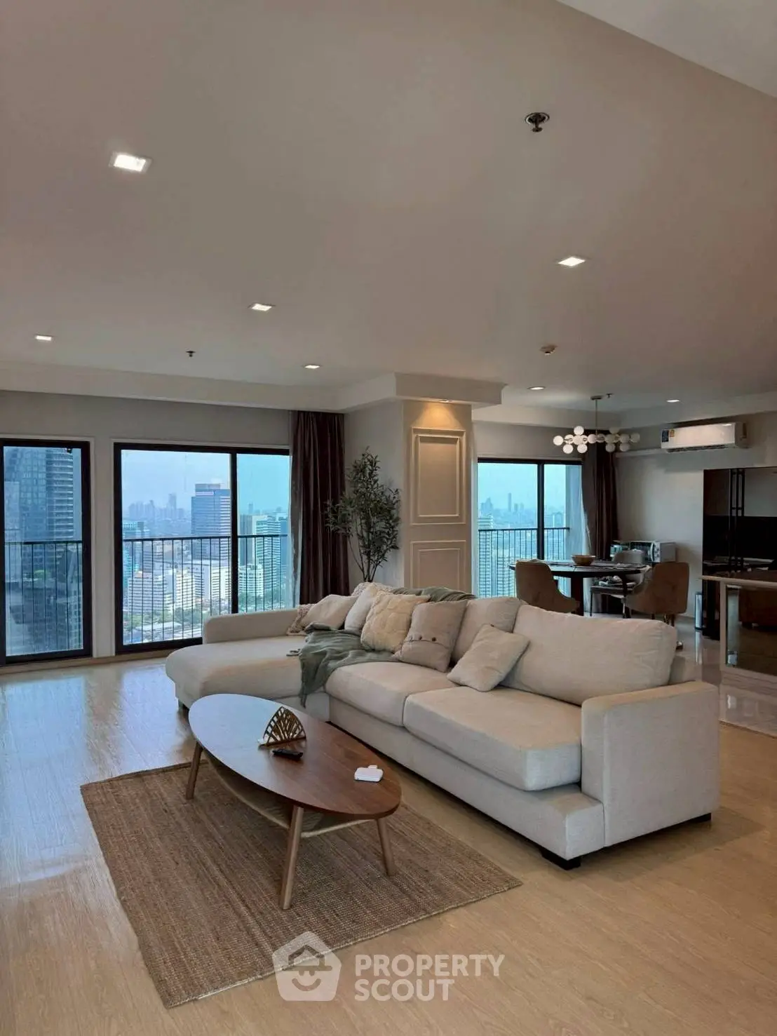 Spacious modern living room with city view and elegant decor