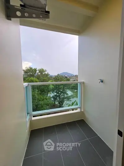Charming balcony with scenic view, perfect for relaxation and enjoying nature's beauty.