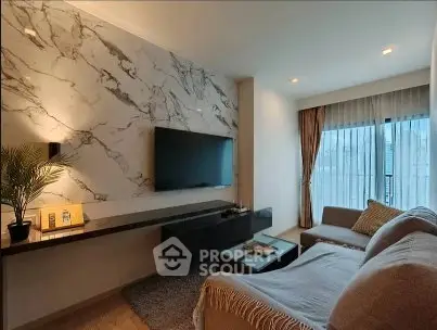 Modern living room with marble accent wall and cozy seating area