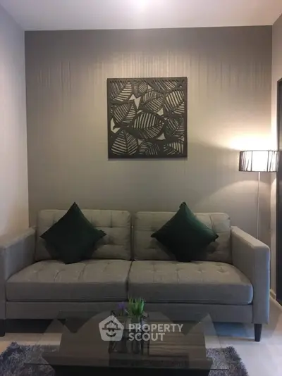 Stylish living room with modern sofa and elegant decor, perfect for cozy relaxation.
