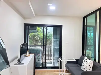 Modern living room with sliding glass doors and cozy sofa