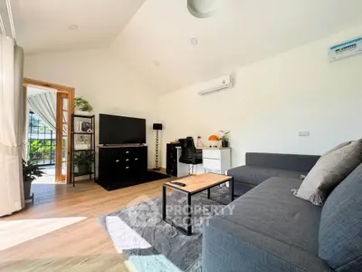 Bright and modern living room with sleek furniture and natural light.