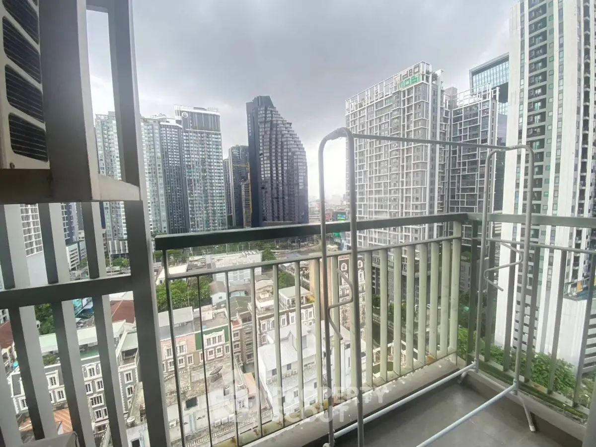 Stunning cityscape view from a modern high-rise balcony, perfect for urban living enthusiasts.