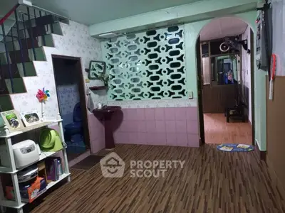 Charming interior with unique decor and open layout, featuring a cozy living area and stylish flooring.