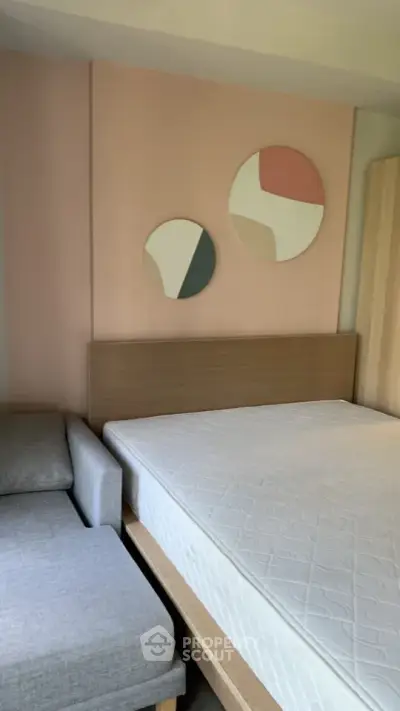Modern bedroom with stylish decor and comfortable bed in a cozy apartment.