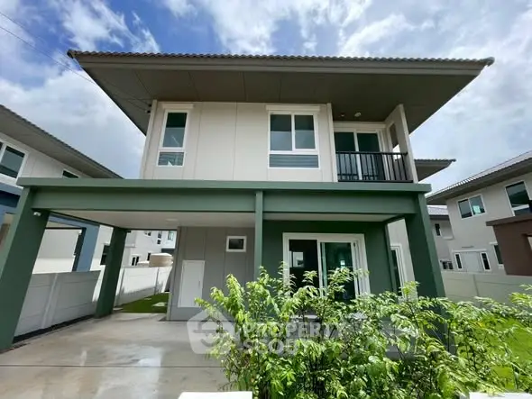 Modern two-story house with sleek design and spacious driveway in a suburban neighborhood.