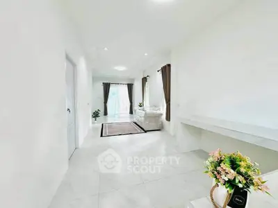 Bright and spacious living room with elegant decor and large windows for natural light.