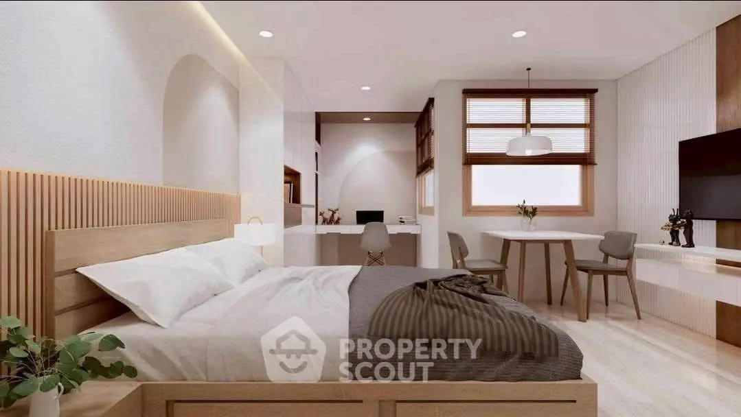 Modern bedroom with stylish decor, featuring a cozy bed, elegant furniture, and ample natural light.