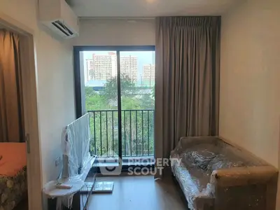 Cozy living room with balcony view in modern apartment