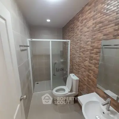 Modern bathroom with stylish tile design and glass shower enclosure